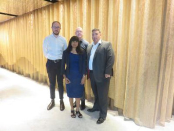 4 people standing smiling for photo